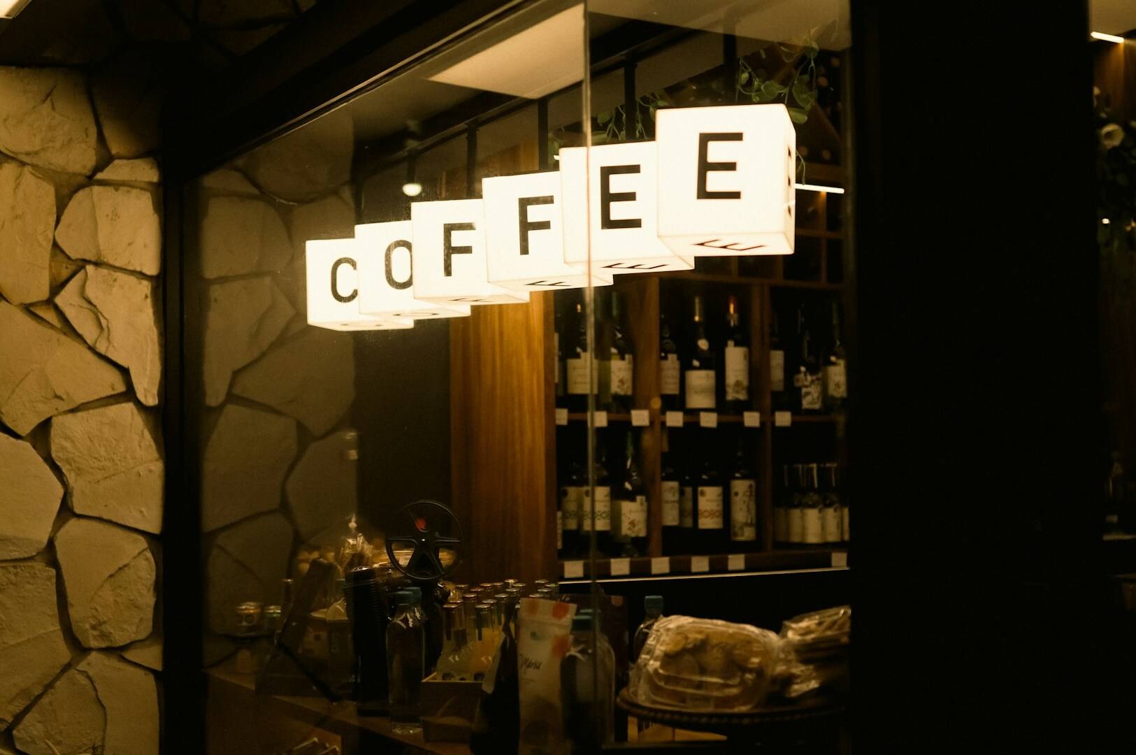 A vibrant coffee shop in Singapore with a sign displaying "Coffee," reflecting the city's rich cafe culture.