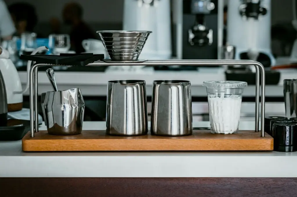 A coffee cup, and a cup holder, representing the essentials of Singapore coffee shops.