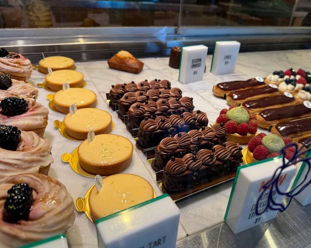 An assortment of pastries shaped with care, showcasing flaky layers and glossy finishes that reflect both precision baking and visual charm.