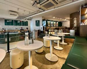 Interior of The Barking Bean Singapore café with cosy seating, warm lighting, and pet-friendly décor creating a welcoming atmosphere.