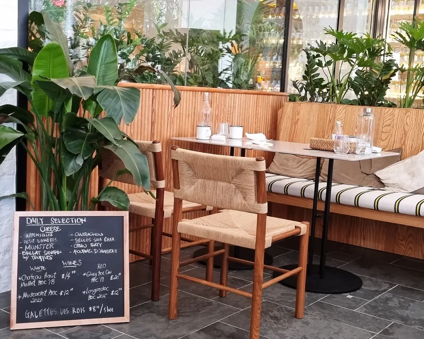 Outdoor table seating at French Fold Orchard, set along the vibrant Orchard Road area, with a cosy Parisian café atmosphere and natural daylight creating a relaxed brunch setting.