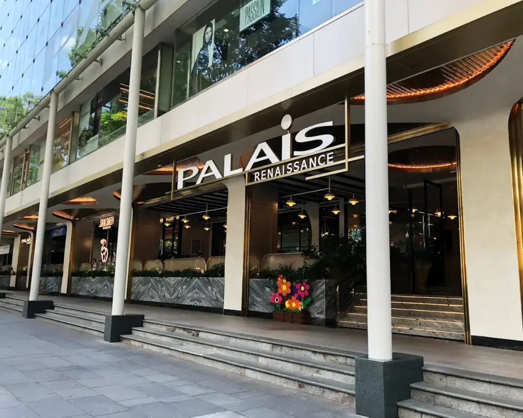 The elegant exterior of Palais Renaissance shopping mall along Orchard Road, showcasing its distinctive architectural design and upscale atmosphere.