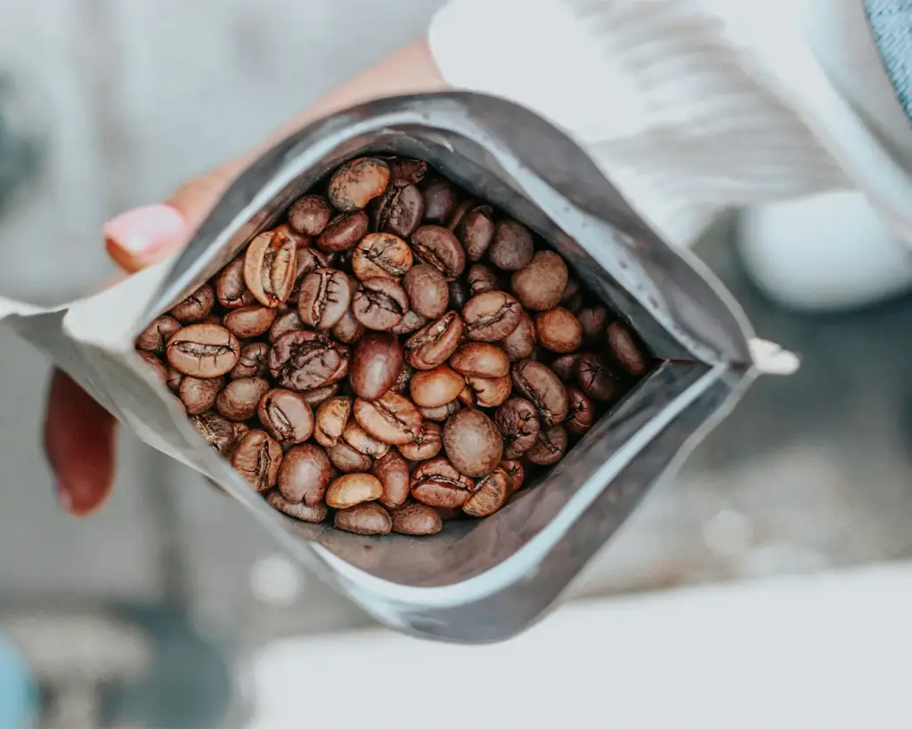 Roasted coffee beans carefully stored inside an airtight sealed bag to maintain freshness, aroma, and flavour for longer storage.