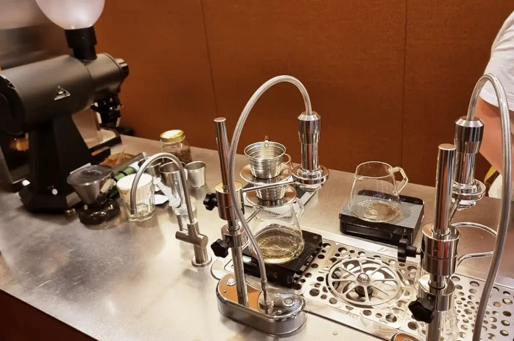 Close-up of professional pour-over coffee brewing equipment on the counter at Nylon Coffee Roasters, highlighting their commitment to high-quality coffee preparation.