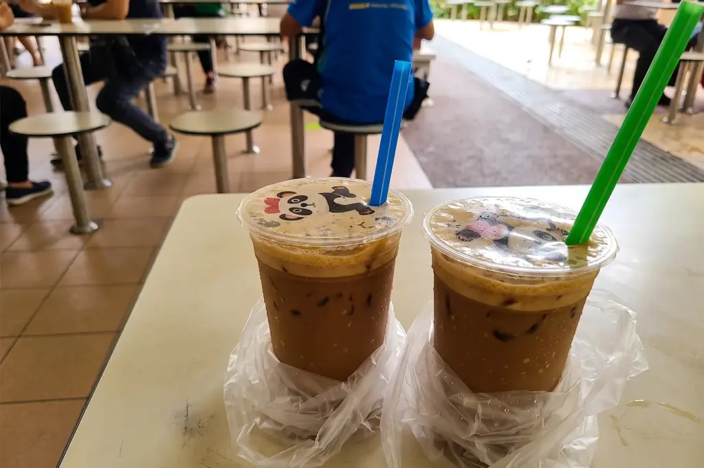 Icef beverages served at Marn Cafe in plastic bags with colorful straws.