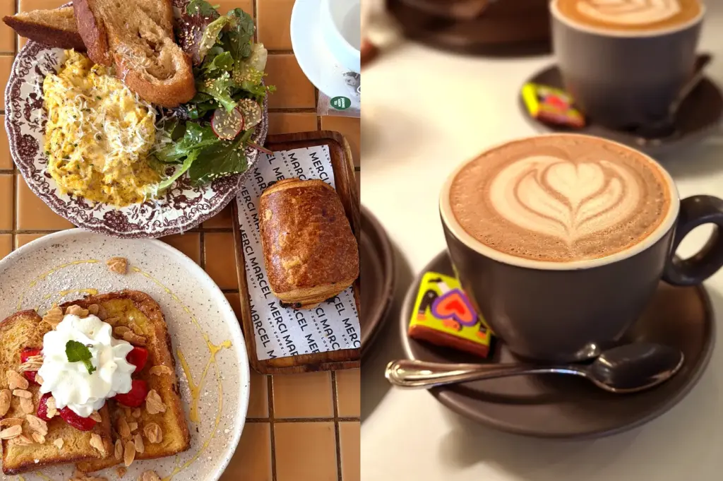 A flat-lay shot of a gourmet French brunch at Merci Marcel, featuring creamy scrambled eggs, artisanal bread, a buttery pastry, and a flat white coffe with latte art.