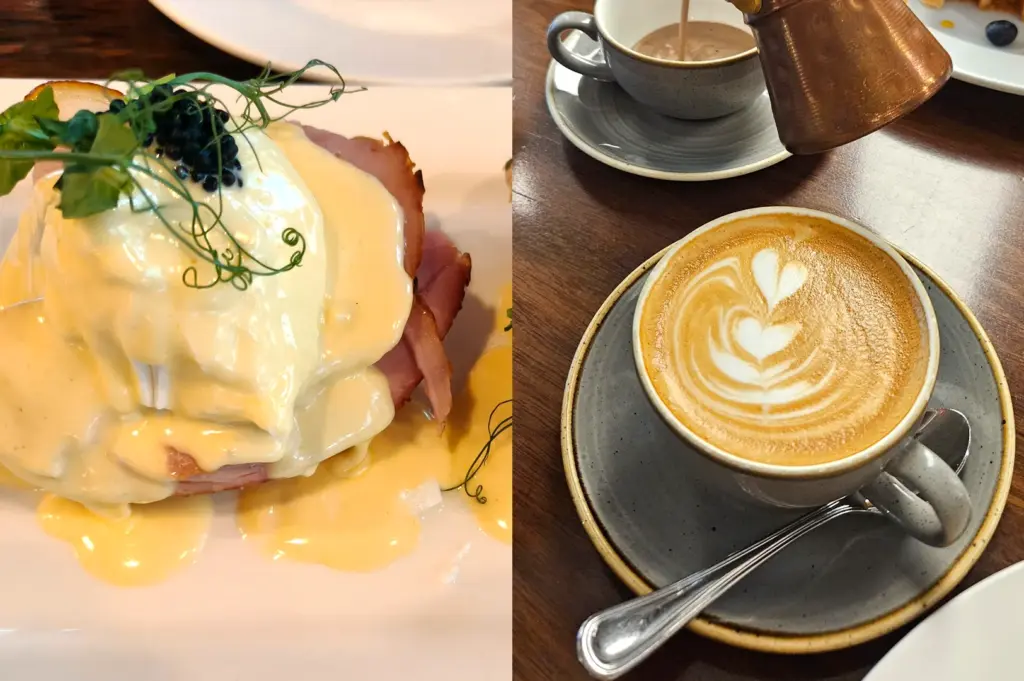 Close-up of a gourmet brunch of the Eggs Benedict with, hollandaise sauce, and caviar served at Wild Honey, paired with a Flat white coffee with intricate heart-shaped latte art.