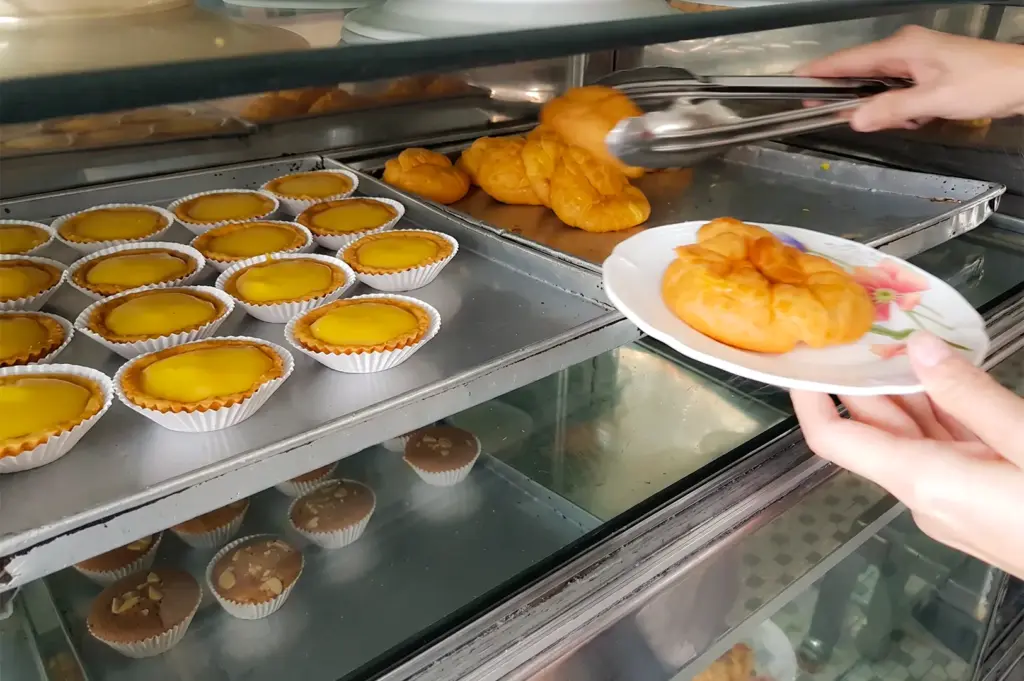 Chin Mee Chin pastry selections placed on silver trays.