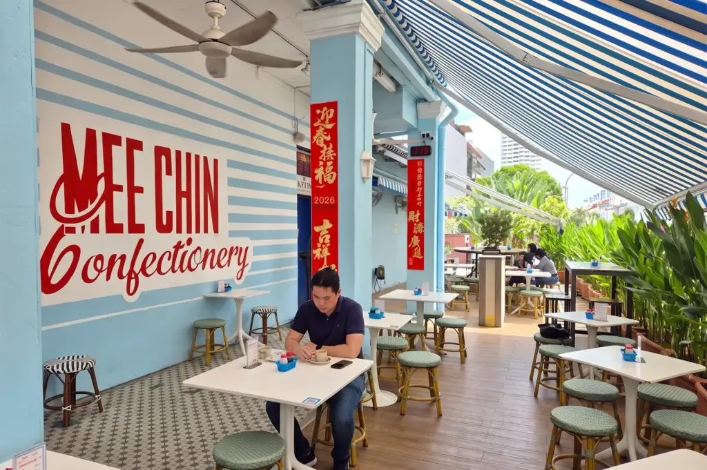 Chin Mee Chin exterior with a single customer dining on a table.
