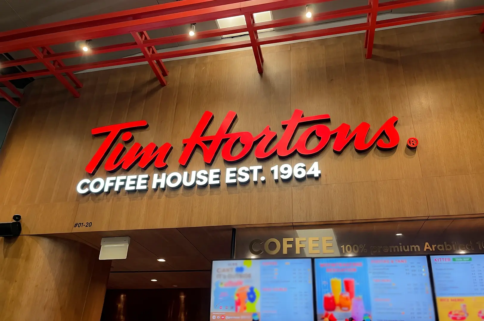 Tim Hortons close up view of their logo signage above the counter.