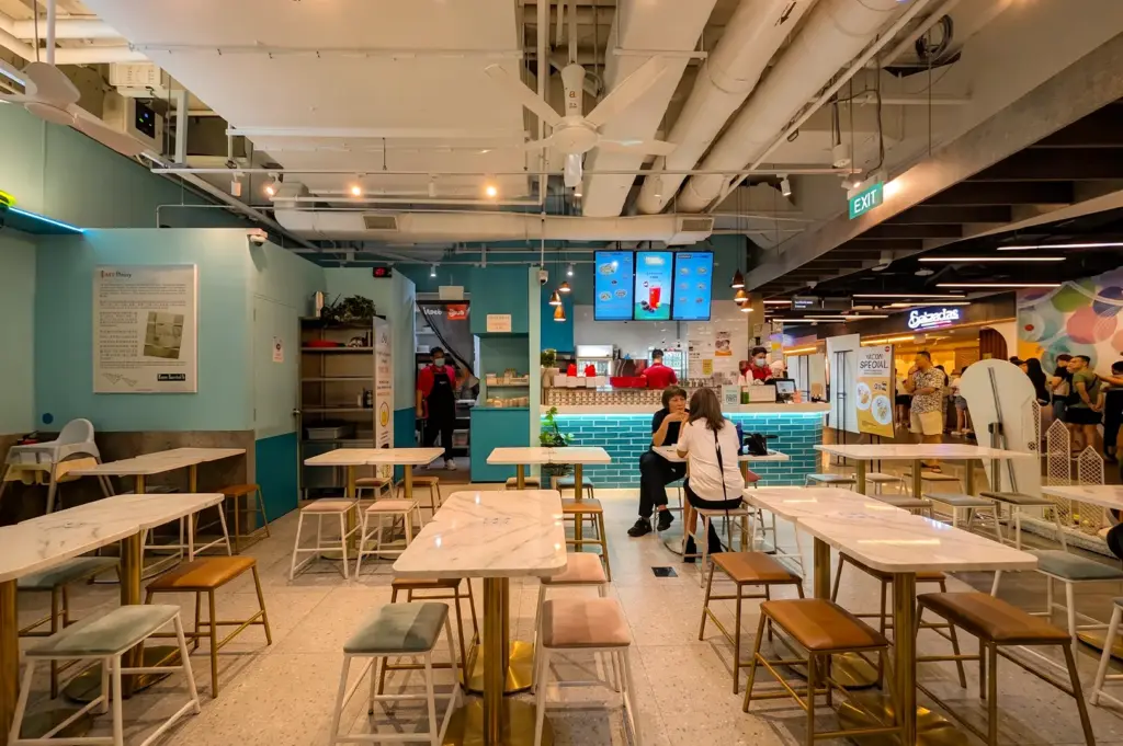 Fun Toast Orchard interior with clean white tables and a few custimers dining inside.