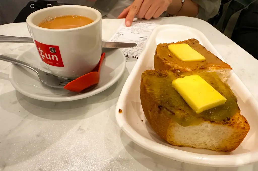 Fun Toast Orchard kopi and toast menu items served on a white table.